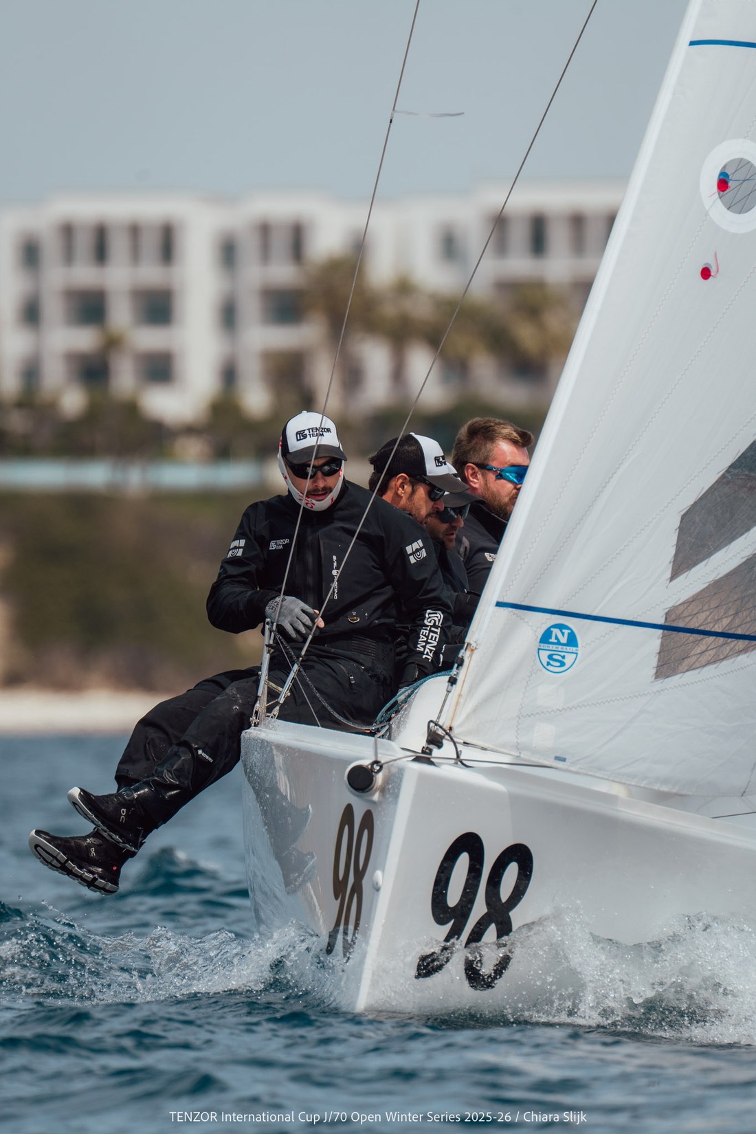 J/70 crew hiking hard upwind