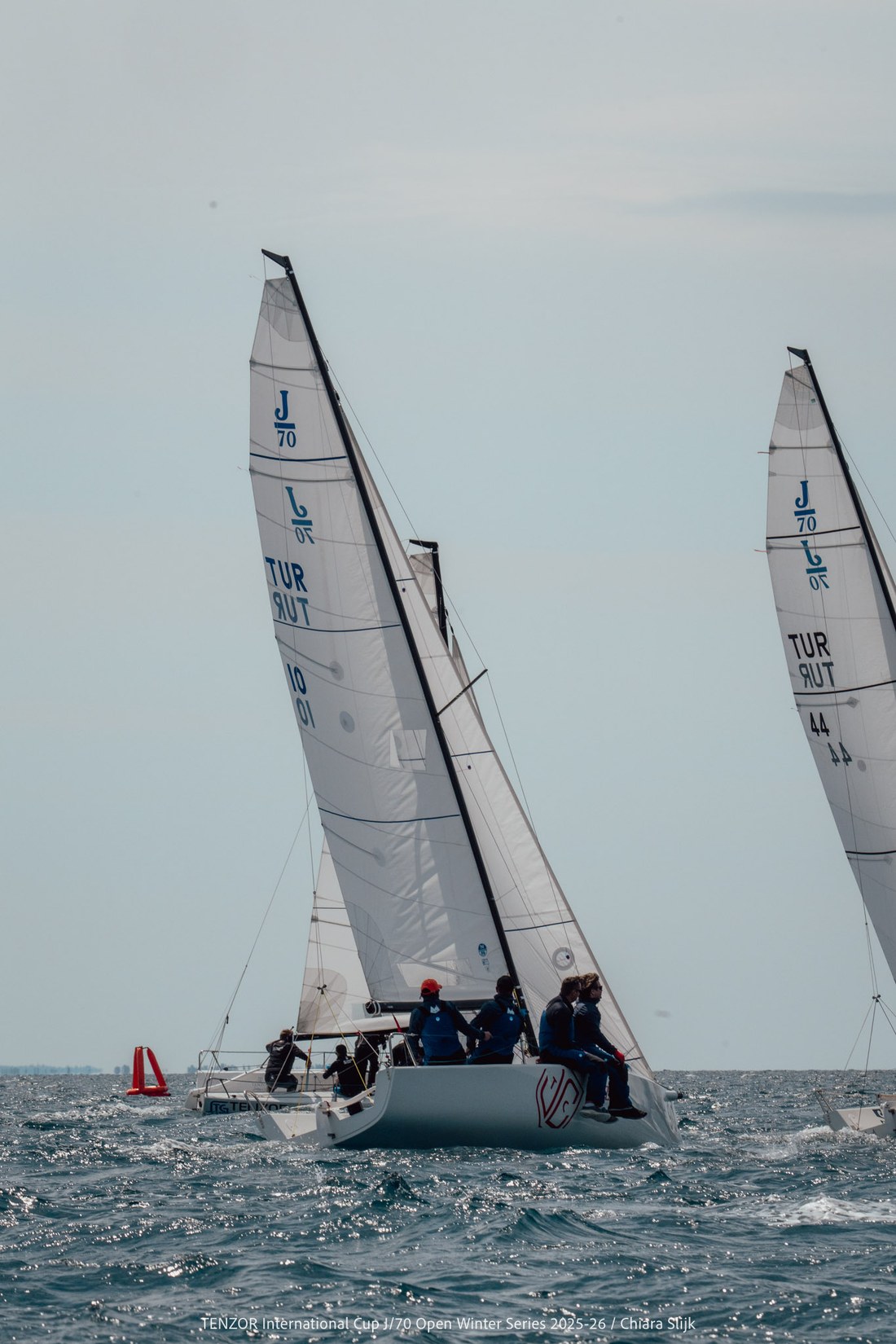 J/70 bow driving hard through spray